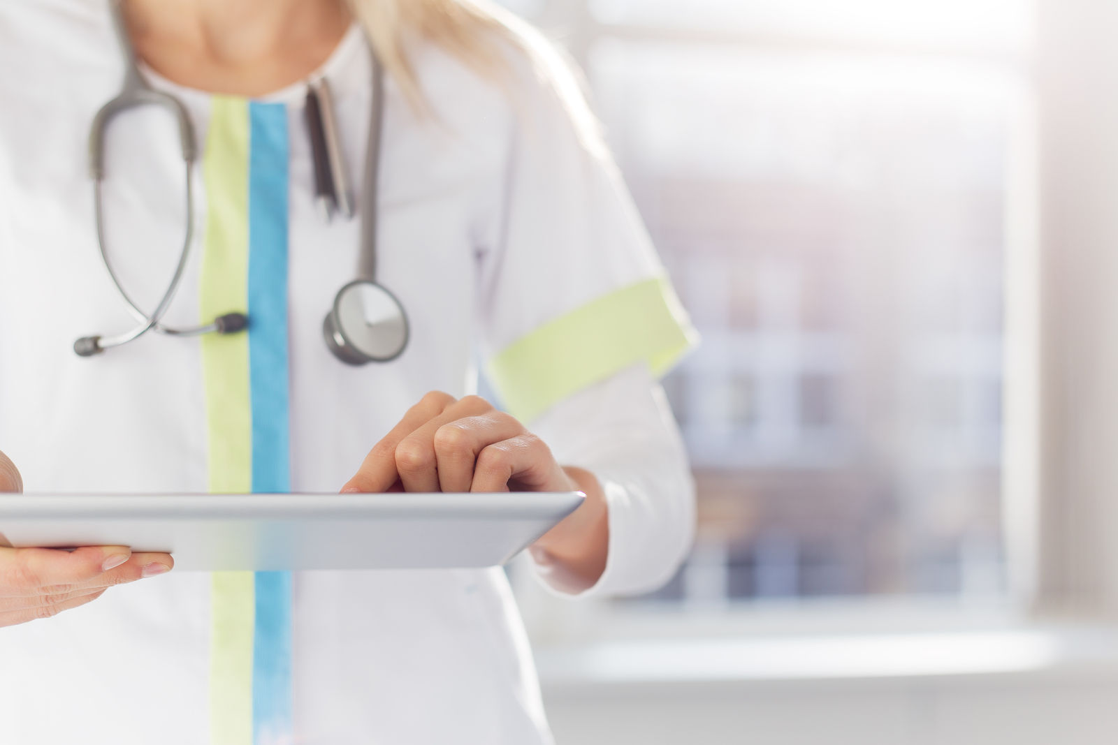 Woman doctor using tablet computer
